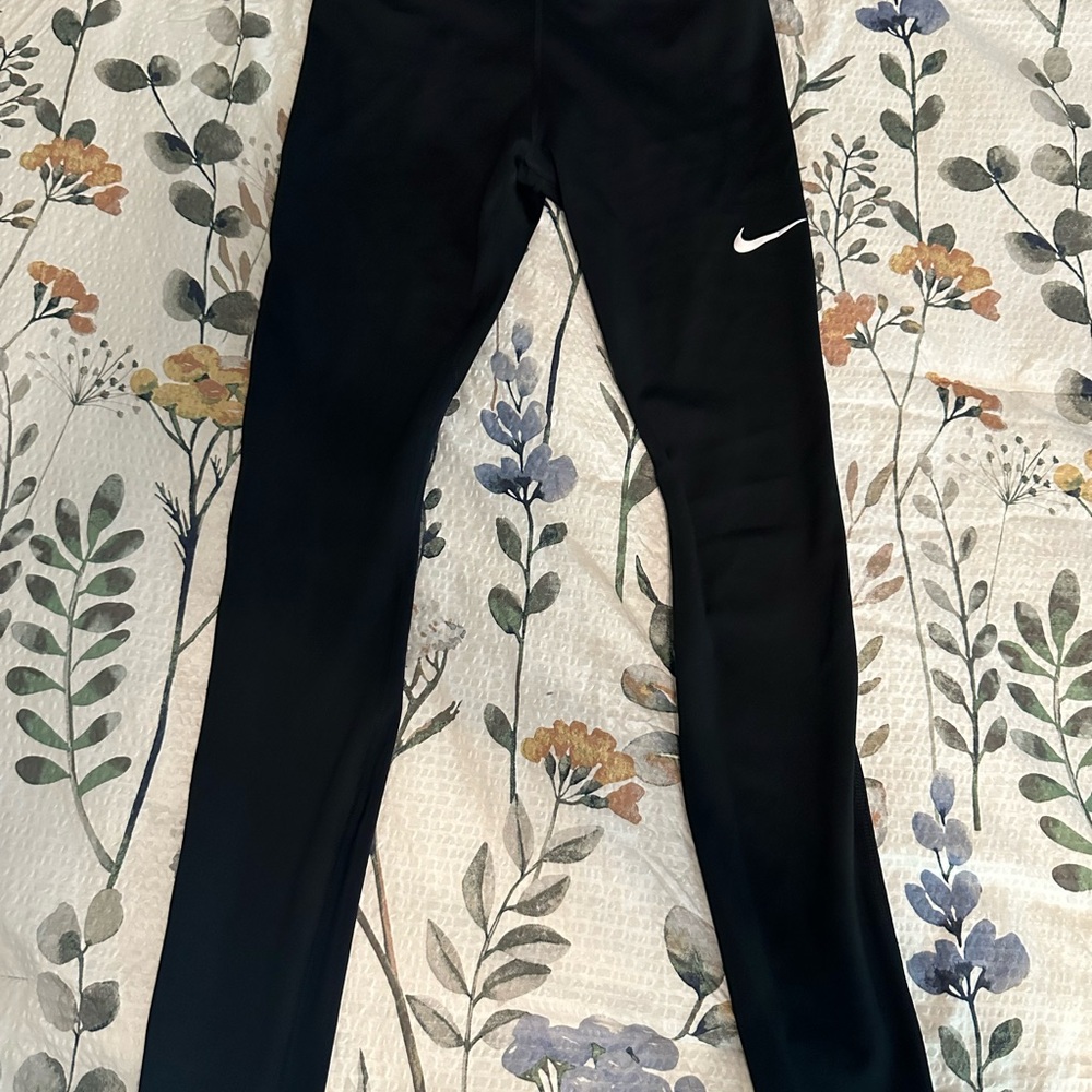 Nike run times Black Leggings with White Swoosh mesh on the bottom of leg